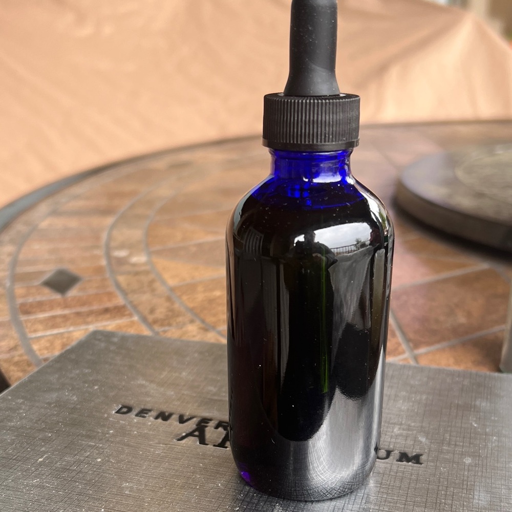 Hand crafted organic Rose oil, jojoba and rose petals! 4 ounce glass w/ droper
